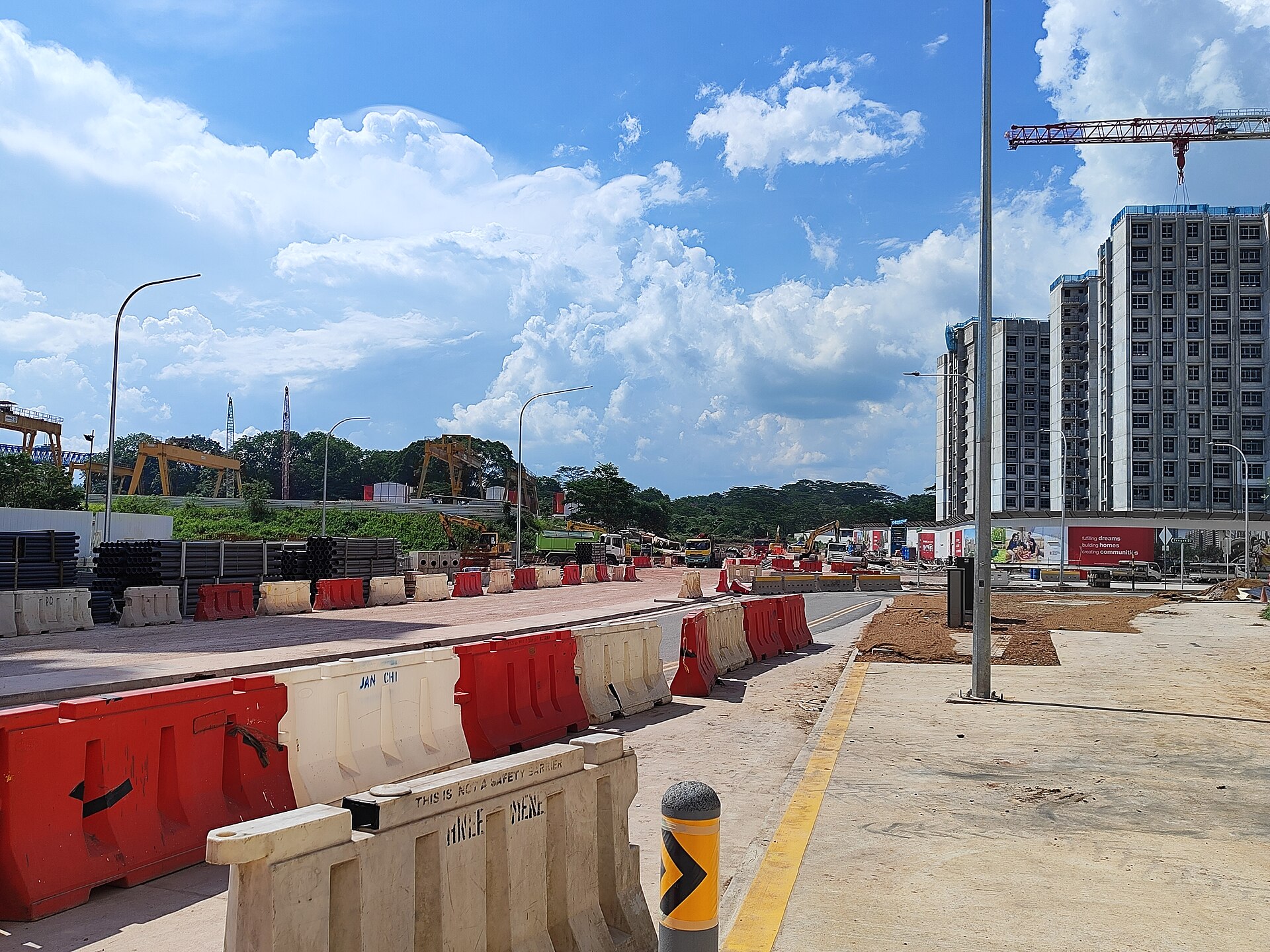 New HDB blocks under construction in Tengah, with bare ground and little shade